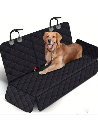 Golden retriever lying on the black quilted back seat cover