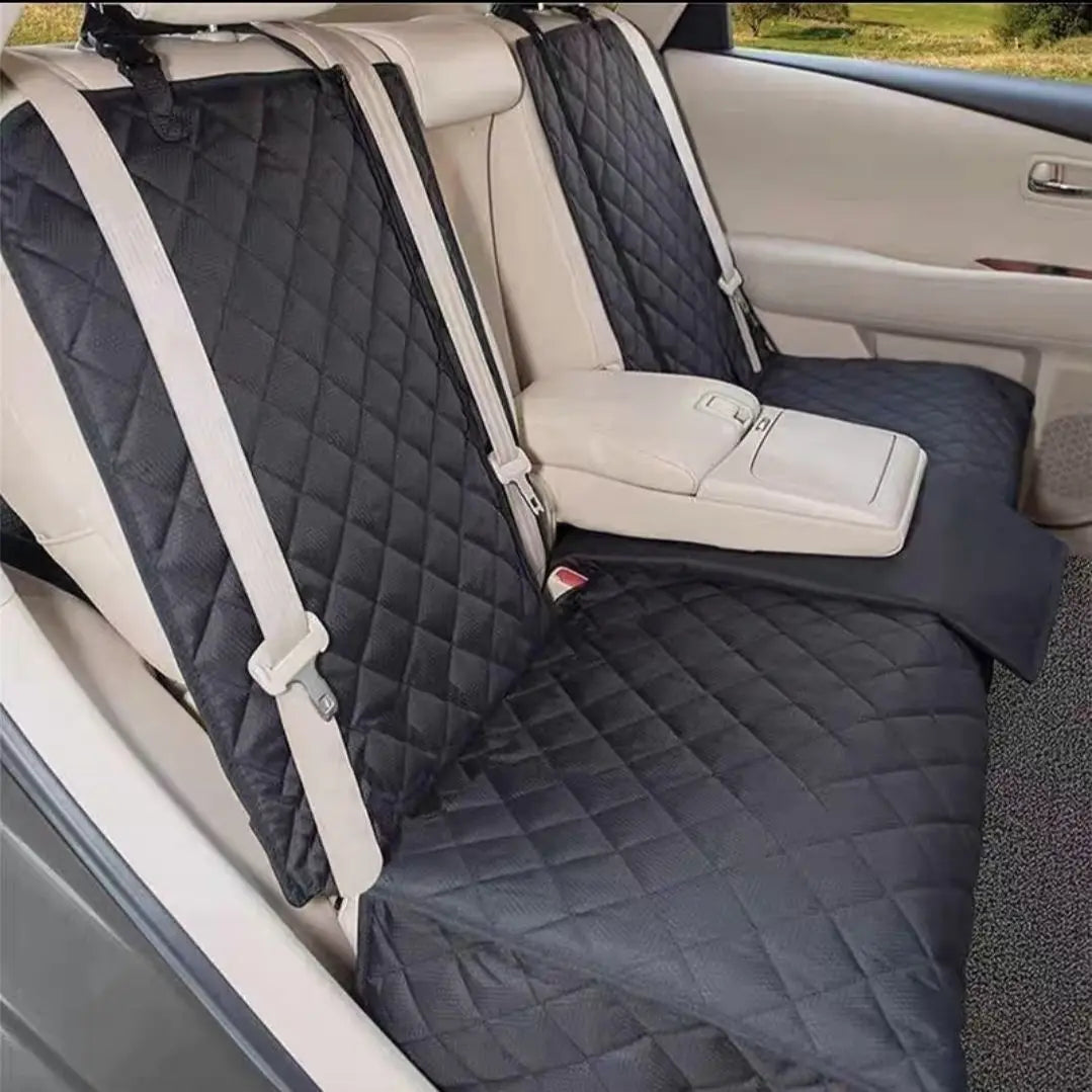 Back seat cover fitted in a car, with the middle armrest folded down through the opening