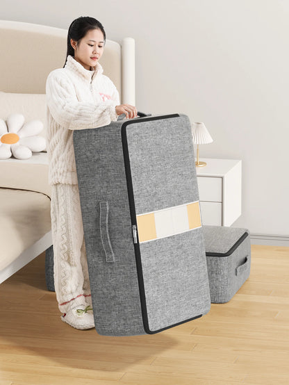 Under-bed storage bag standing on its end next to a bed