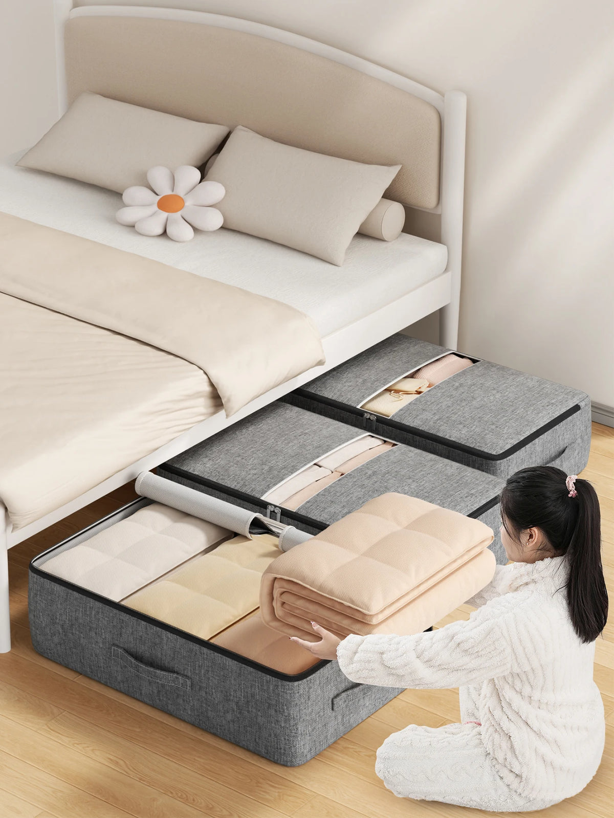 Under-bed storage bags holding a quilt, slid under a bed