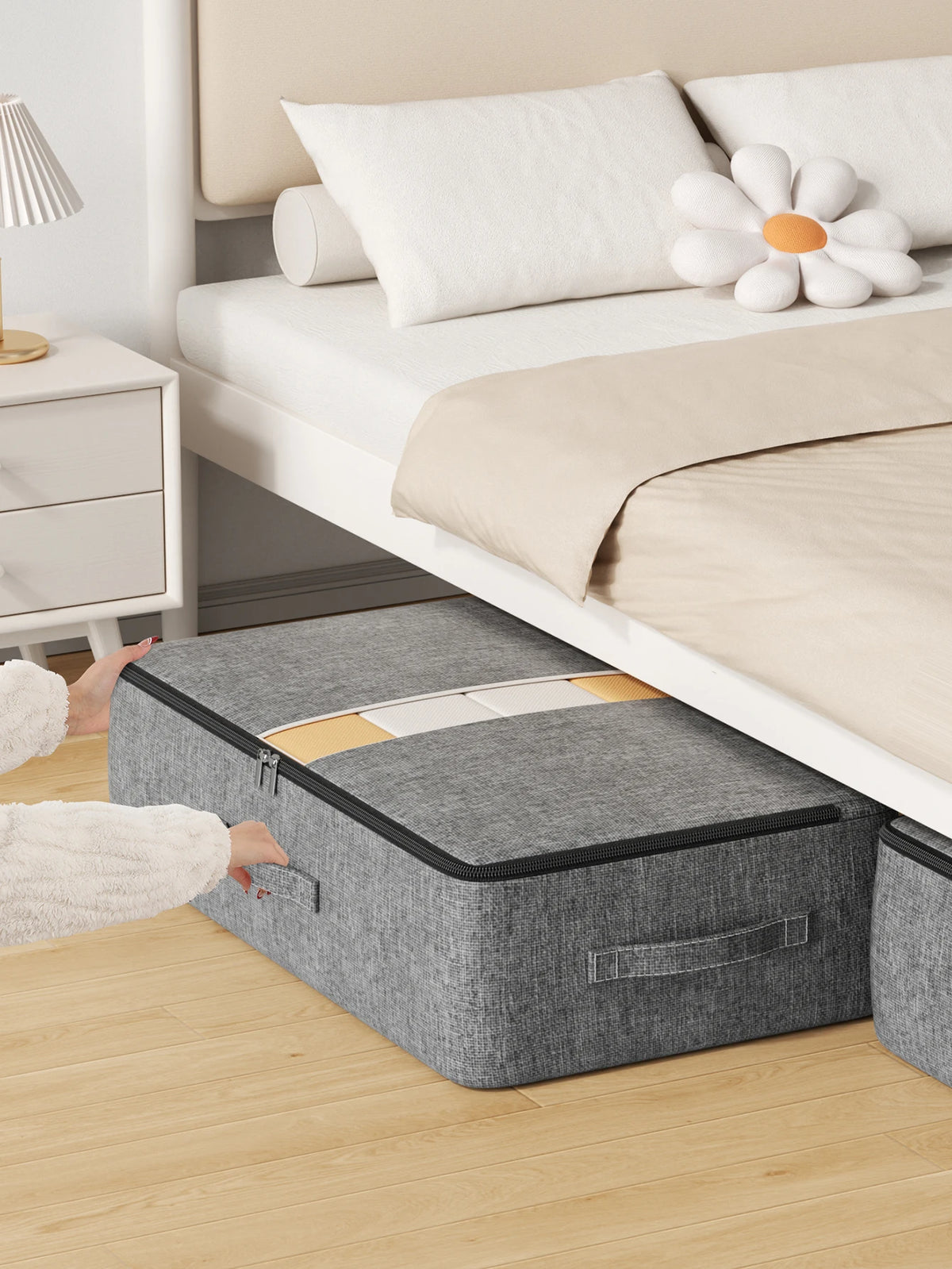 Grey under-bed storage bag pushed under a bed