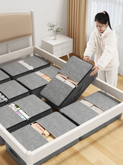 Several under-bed storage bags fitted inside a bed frame