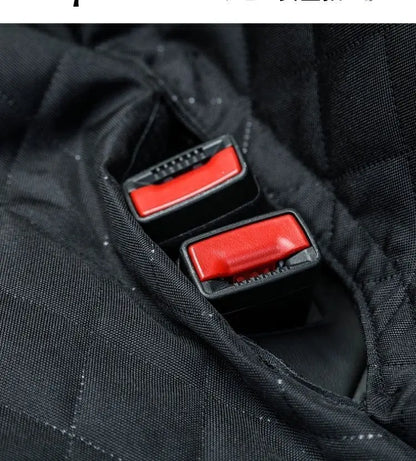 Close-up of seat belt buckles coming through the seat cover's openings