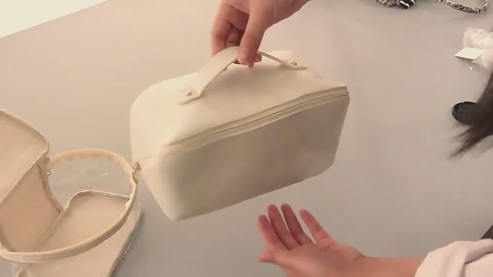 Packing toiletries into the soft toiletry bag