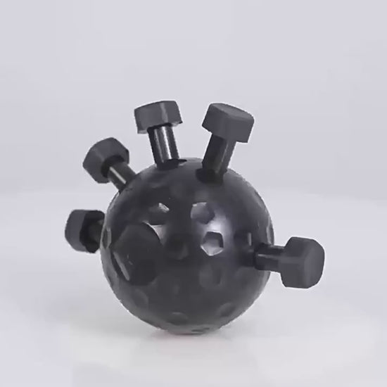 A hand squeezing the finger strength trainer ball