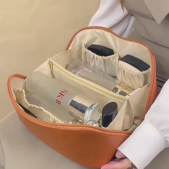 Packing toiletries into the soft toiletry bag