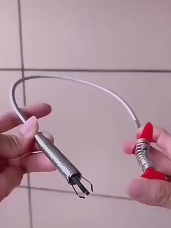 Clearing hair from a drain with the catcher tool