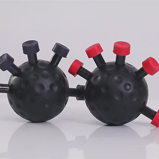 A hand squeezing the finger strength trainer ball
