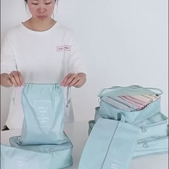 Packing clothes into the packing cubes